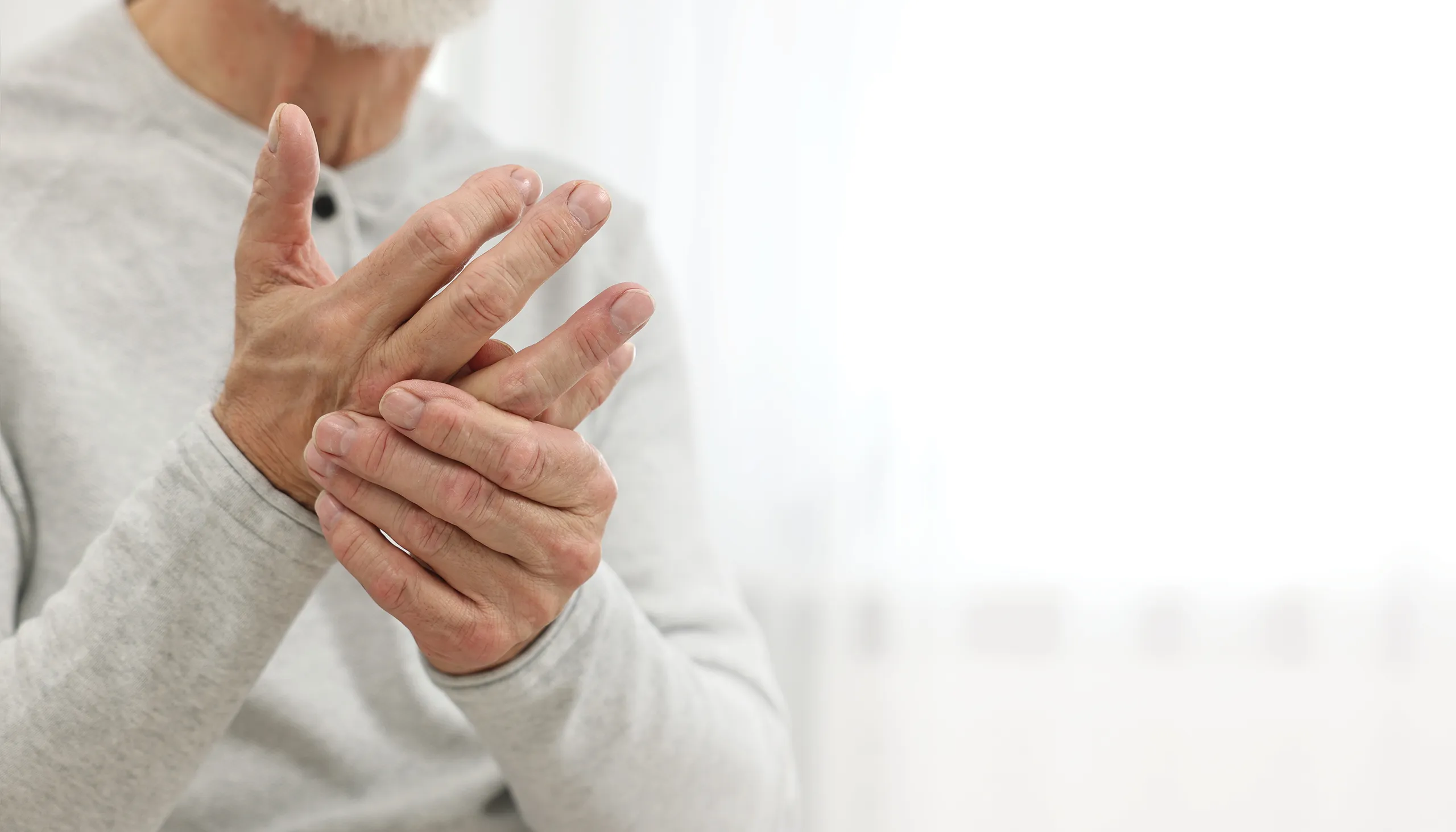 Person holding injured hand