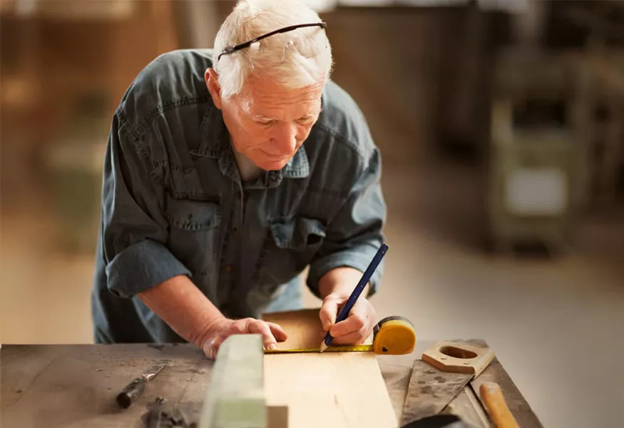 Older man working with hands